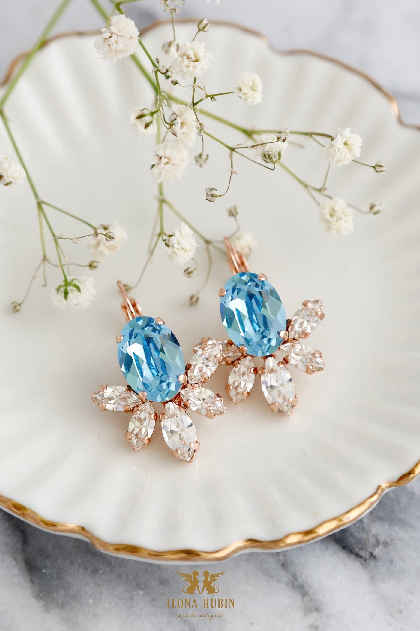 Aquamarine Light Blue Crystal Drop Earrings. Featuring sparkling aquamarine crystals in a delicate drop design, these earrings are perfect for any occasion. Ideal for gifting or adding a touch of sophistication to your outfit