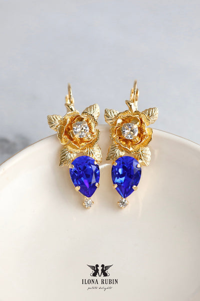 Floral Royal Blue Crystal Drop Earrings feature stunning Austrian crystals. They are perfect for adding a touch of sophistication to any outfit. Ideal for special occasions or everyday glamour, they make a thoughtful gift for someone special.