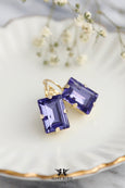 These Purple Tanzanite Crystal Earrings, embellished with Swarovski® crystals, are an exquisite choice for the bride&#39;s mother or any special occasion. Their stunning violet hue enhances elegant attire, making them perfect for celebrating in style.
